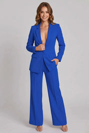 Woman wearing a blue suit on a gray background