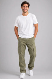 Man wearing a white t-shirt and green cargo pants on a gray background