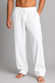 White pants worn by a person on a gray background