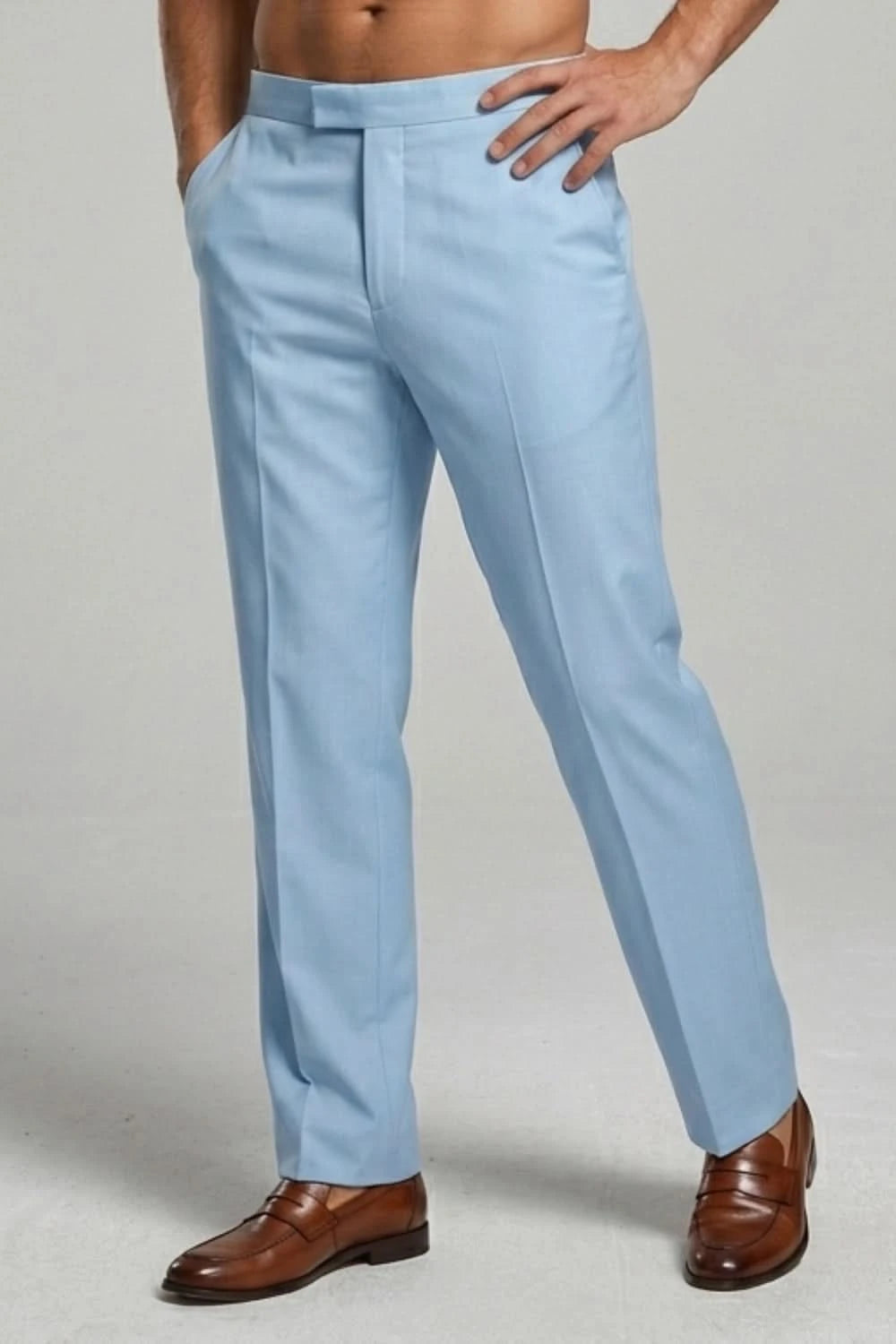 Light blue dress pants worn by a person on a plain background